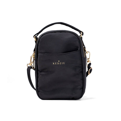 Black crossbody bag with 'KEDZIE' branding on a white background