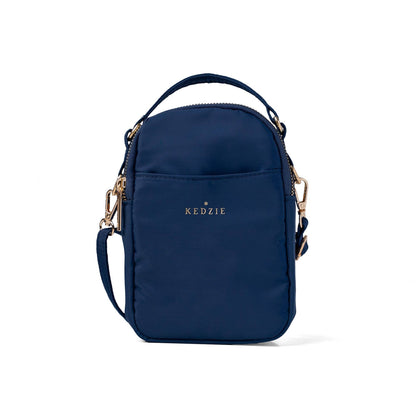 Navy blue crossbody bag with gold accents on a white background